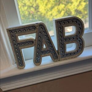 Gray and Silver Decorative 'FAB' Sign